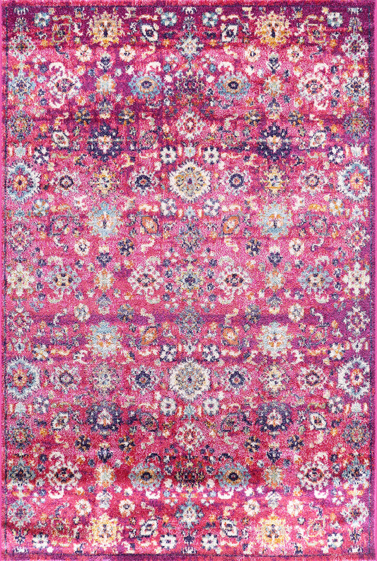 Colorful floral patterned rug on a pink background
