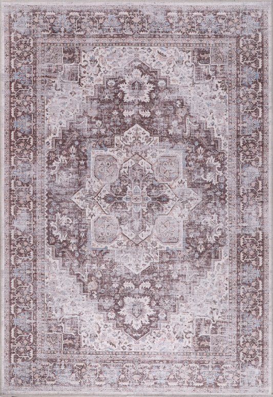 Decorative rug with intricate pattern on a light gray background