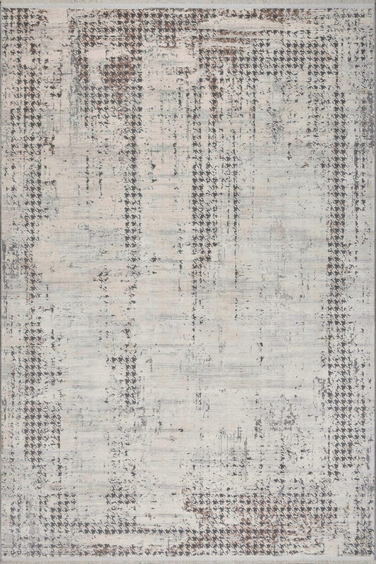 Textured area rug with a patterned design on a neutral background