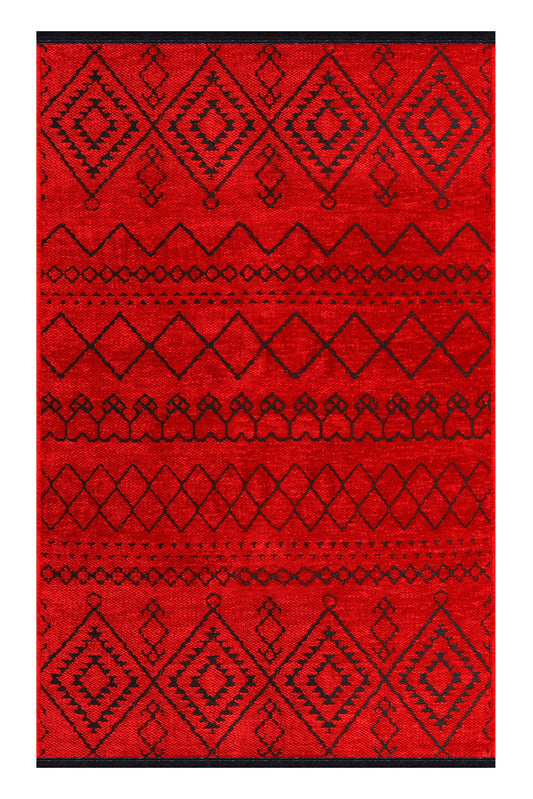 Red rug with black geometric pattern on a white background