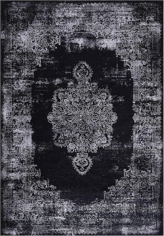 Decorative black and white rug with intricate patterns