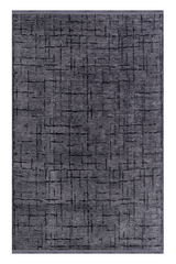Gray area rug with black abstract pattern on a white background