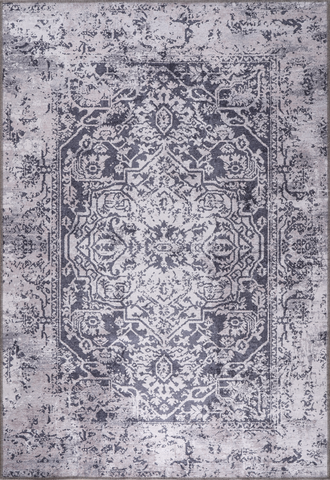 Decorative rug with intricate pattern on a light gray background