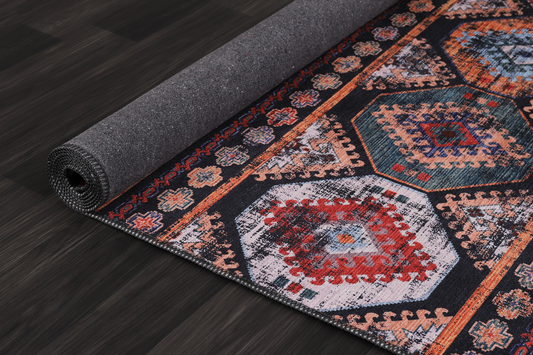 Decorative rug with geometric pattern on a wooden floor