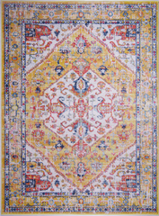 Decorative rug with a multicolored pattern on a white background