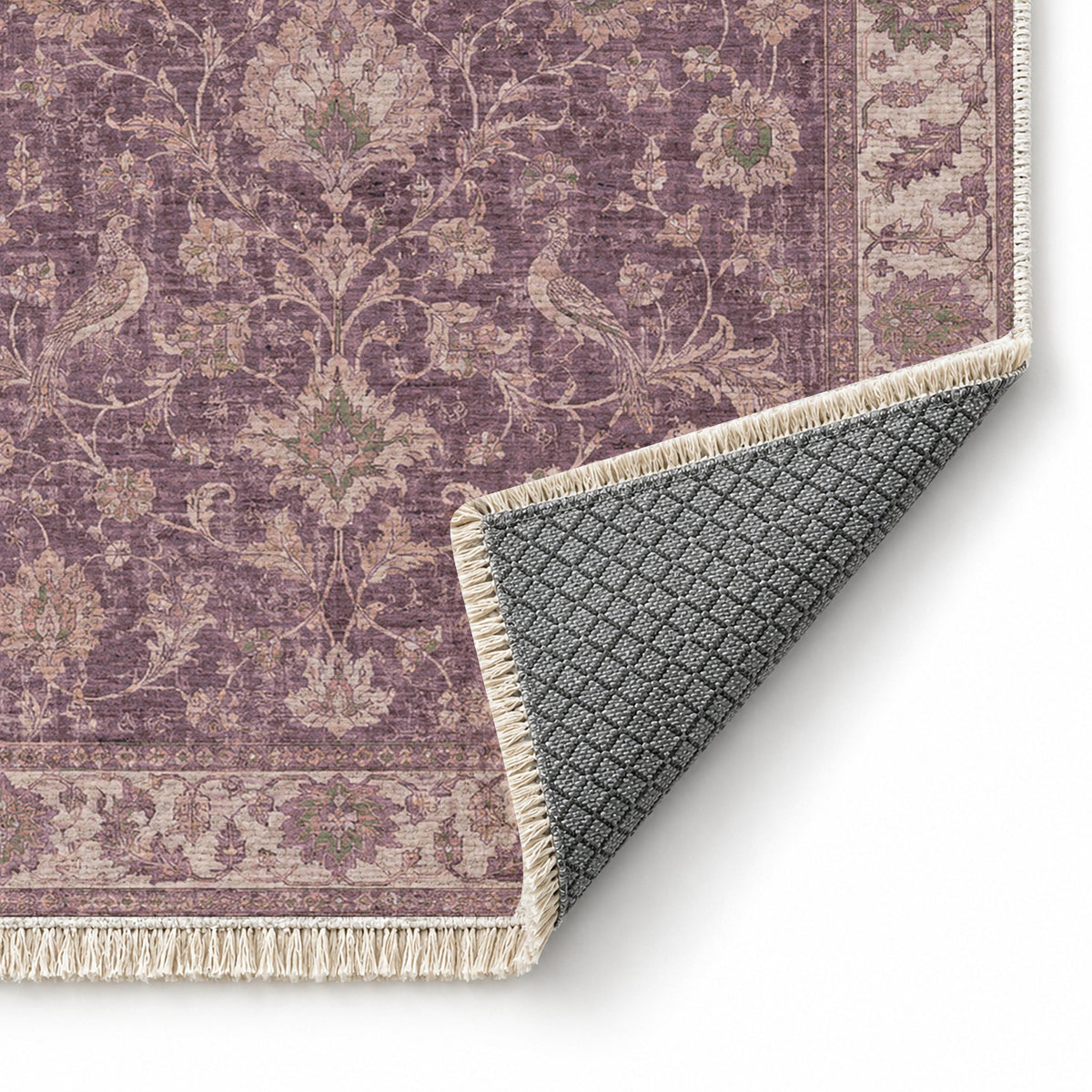 Bird Arabesque Rose & Olive washable rug folded corner showing the backing