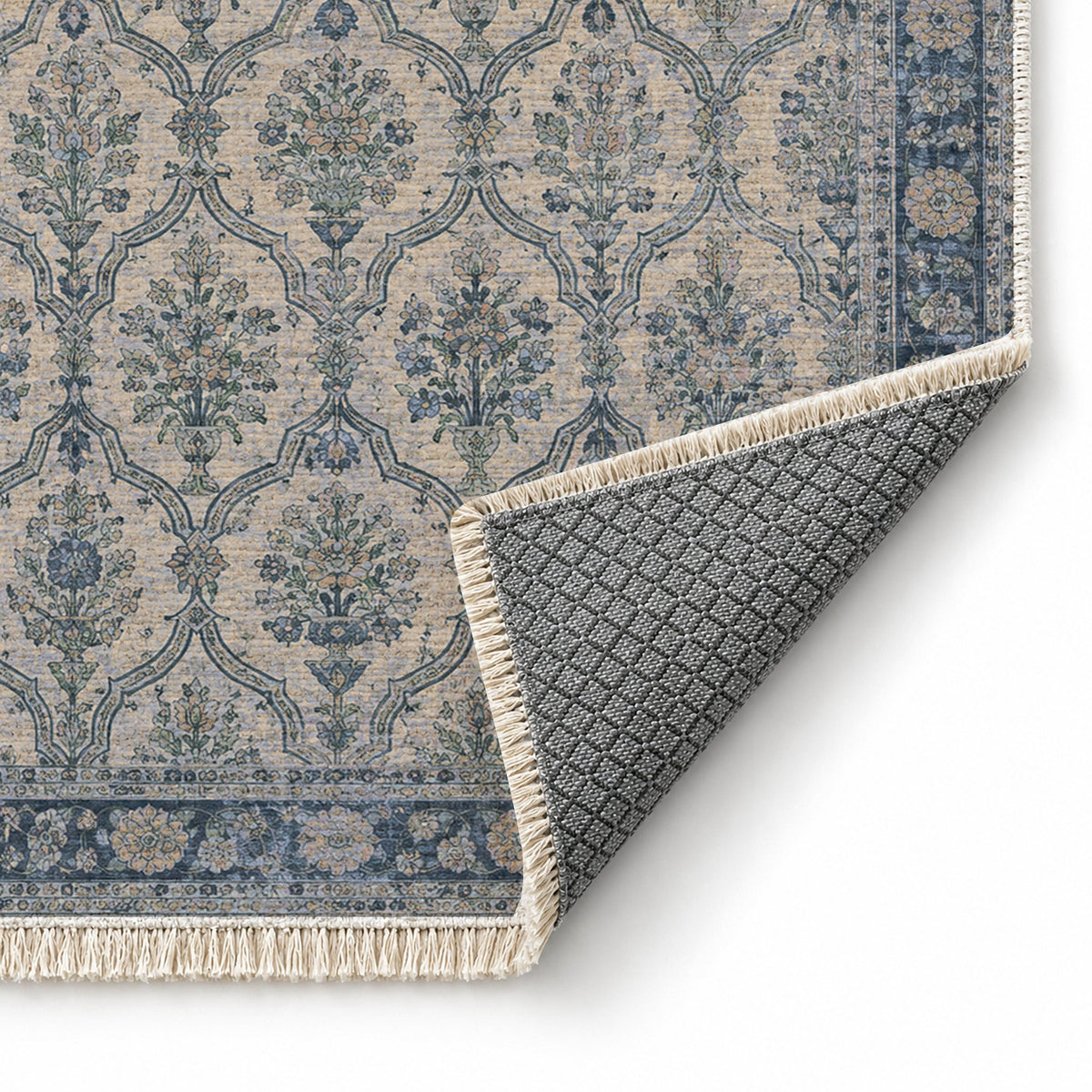 Bouquet Cartouches Mineral Blue washable rug folded corner showing the backing