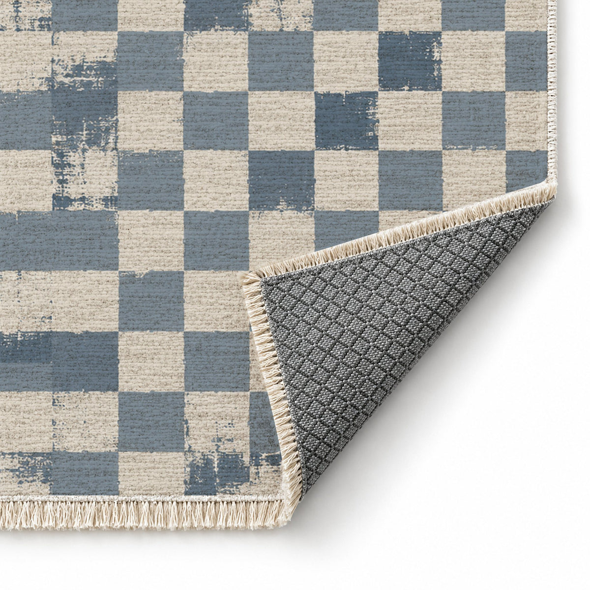 Broken Checker Ivory & Dusty Blue washable rug folded corner showing the backing