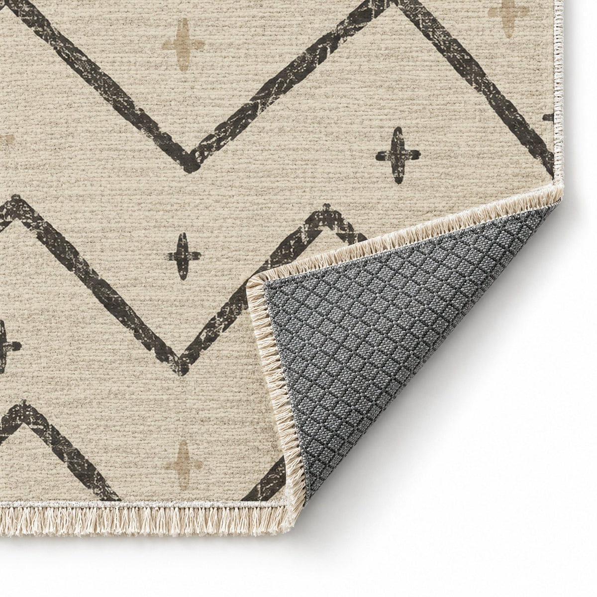 Broken Chevron Ivory & Charcoal washable rug folded corner showing the backing