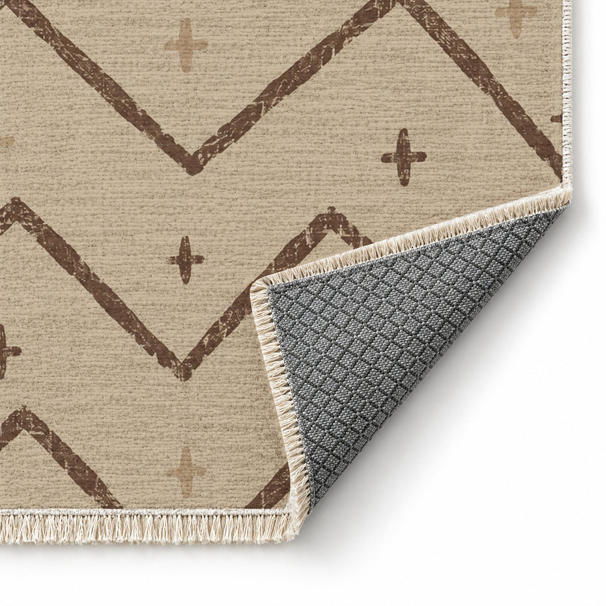 Broken Chevron Oat & Cocoa washable rug folded corner showing the backing