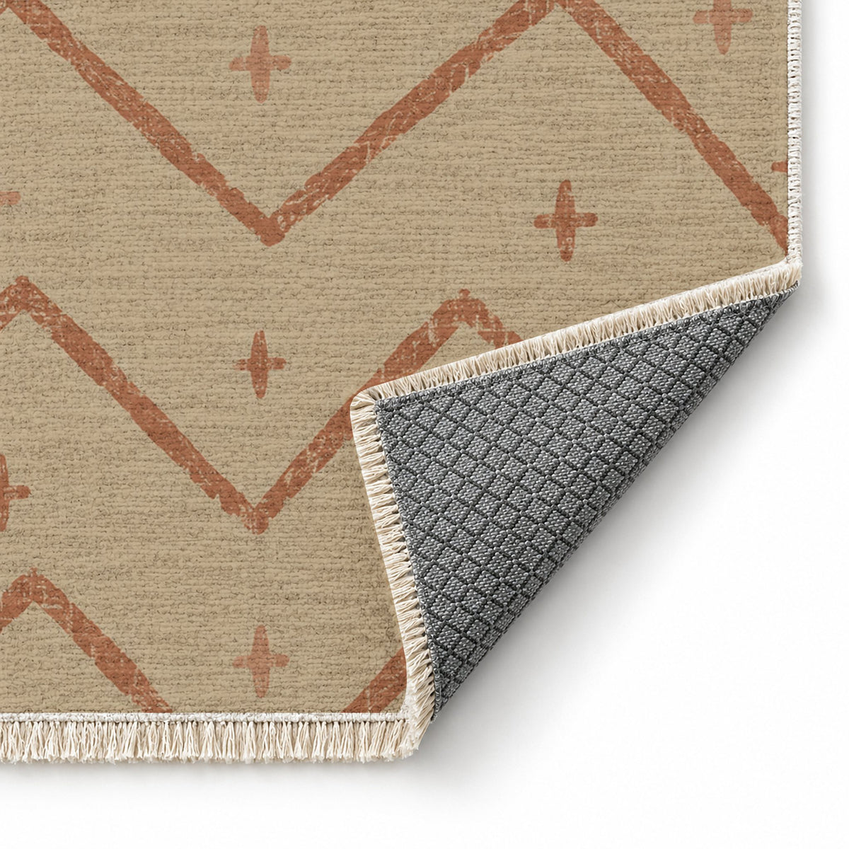 Broken Chevron Sand & Terracotta washable rug folded corner showing the backing