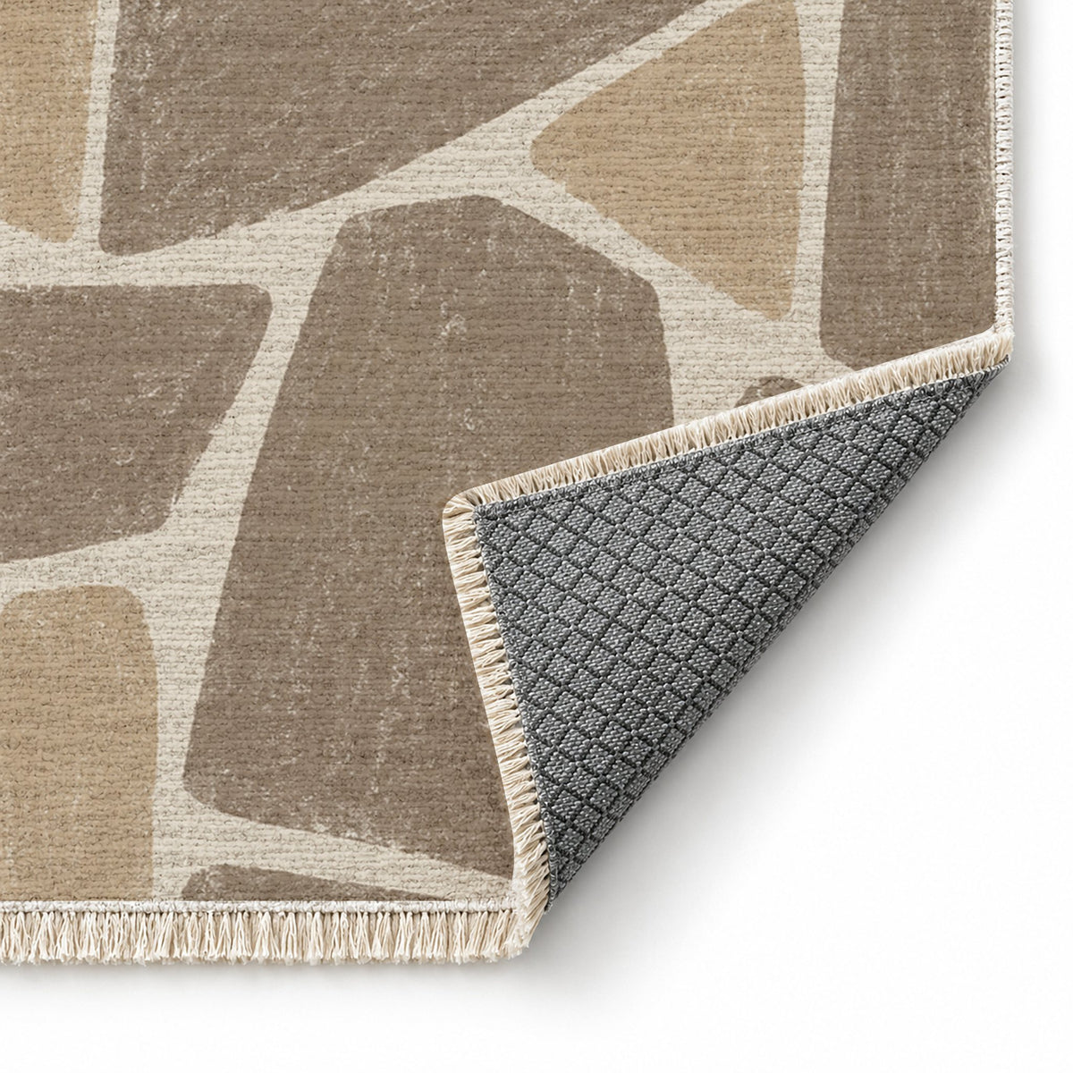 Chalk Fragment Ivory & Taupe washable rug folded corner showing the backing