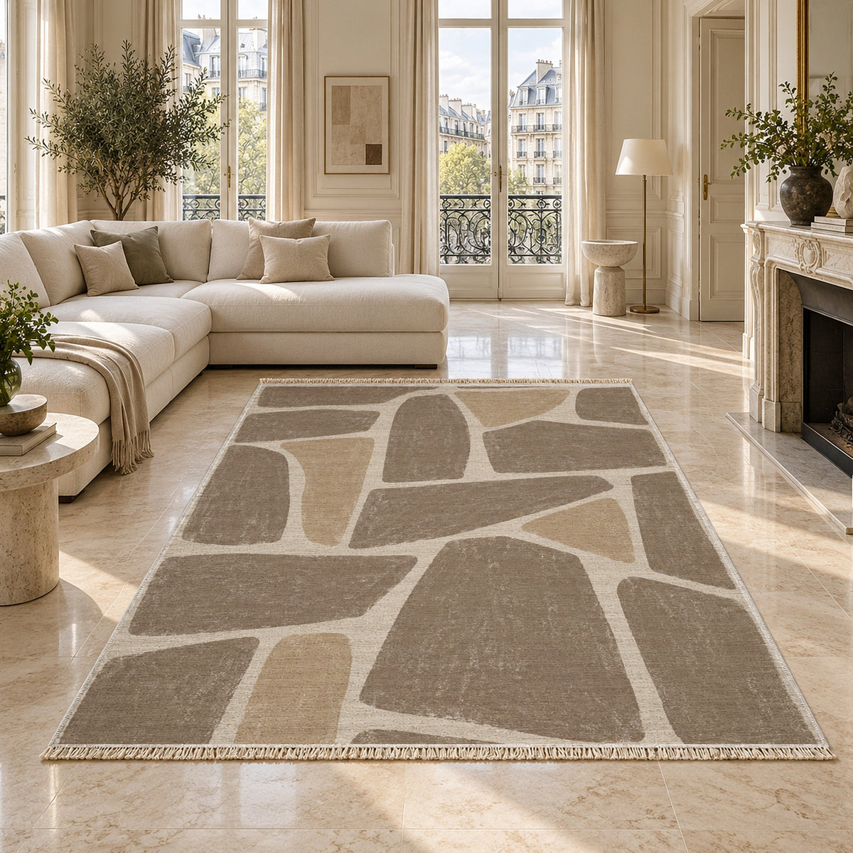 Chalk Fragment Ivory & Taupe washable rug on a marble floor