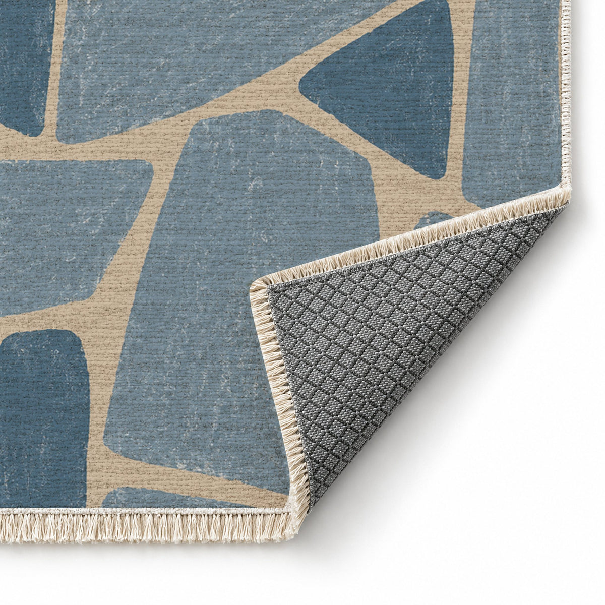 Chalk Fragment Oat & Dusty Blue washable rug folded corner showing the backing