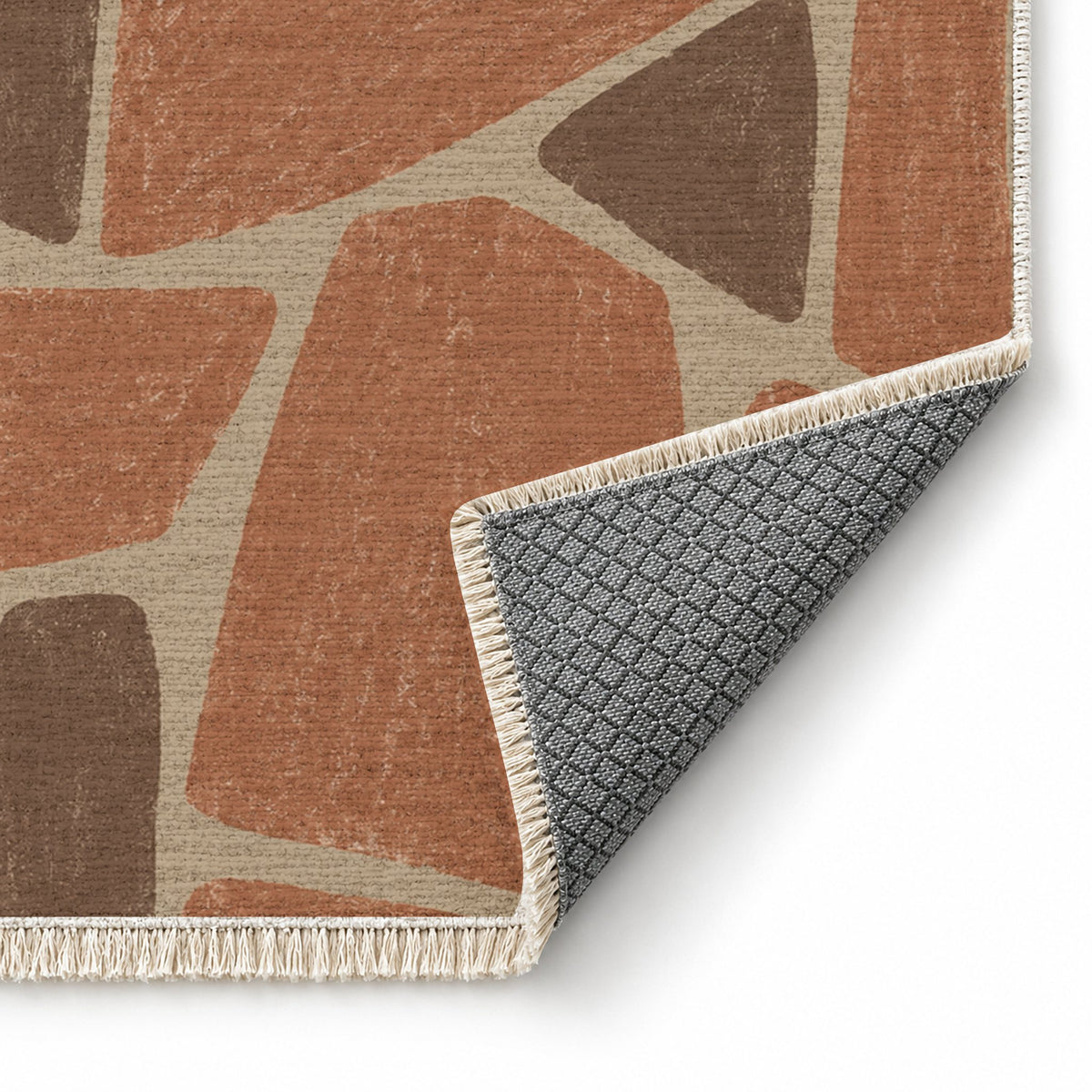 Chalk Fragment Sand & Terracotta washable rug folded corner showing the backing