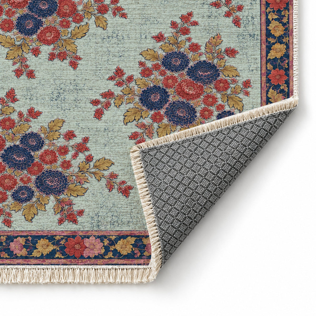 Chrysanthemum Islands Glacier, Ink & Vermilion washable rug folded corner showing the backing