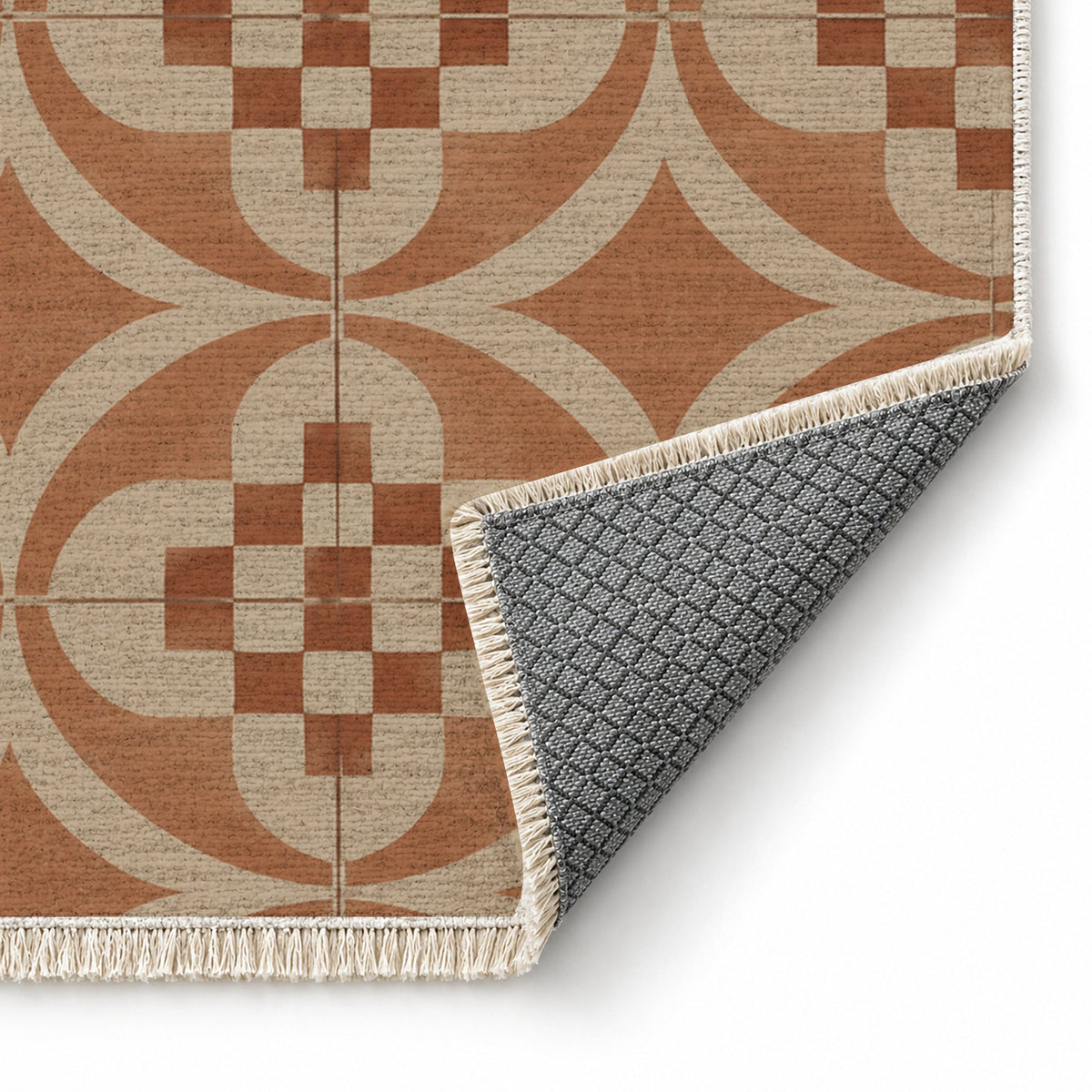 Courtyard Tile Sand & Terracotta washable rug folded corner showing the backing