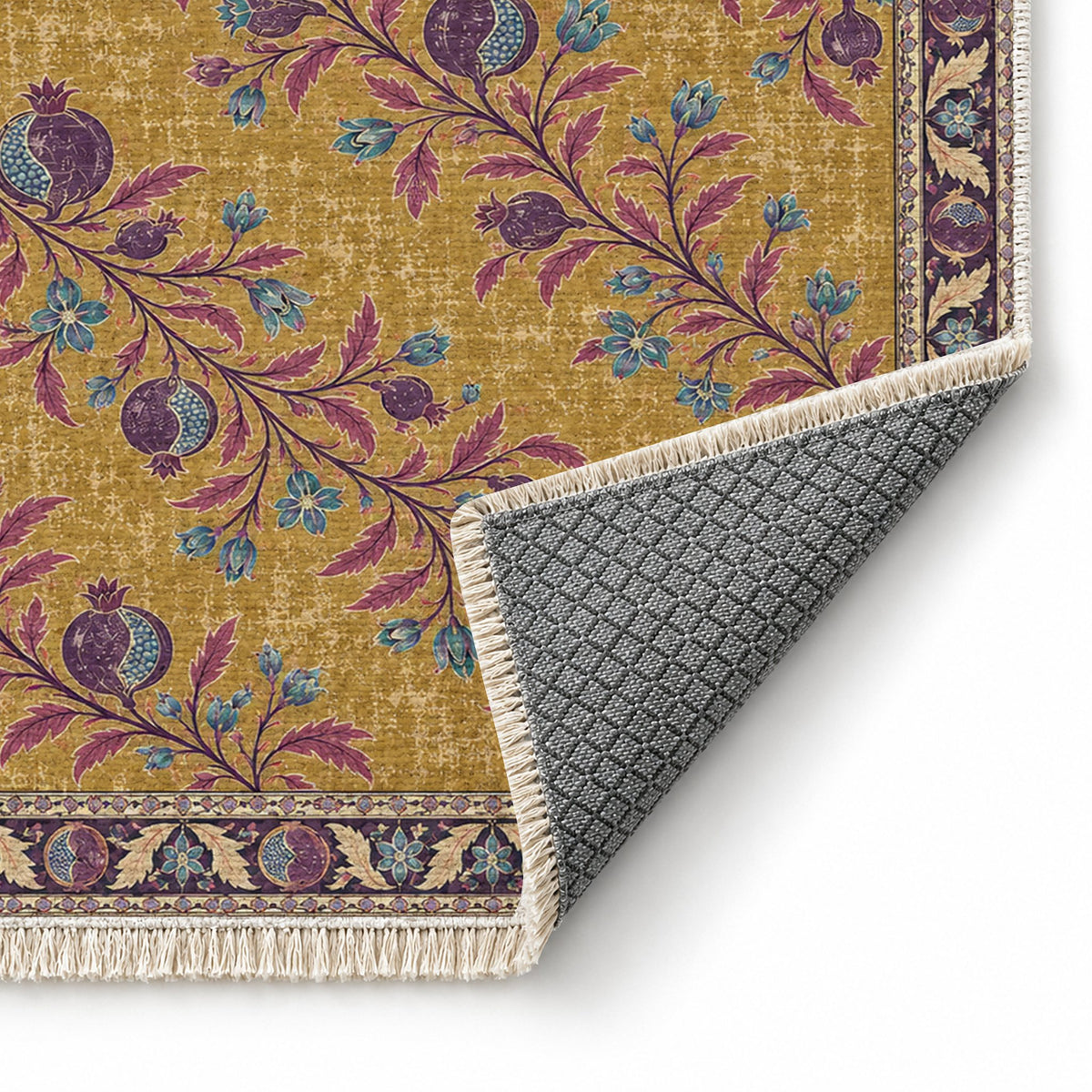 Diagonal Pomegranate Canopy Golden, Plum & Azure washable rug folded corner showing the backing