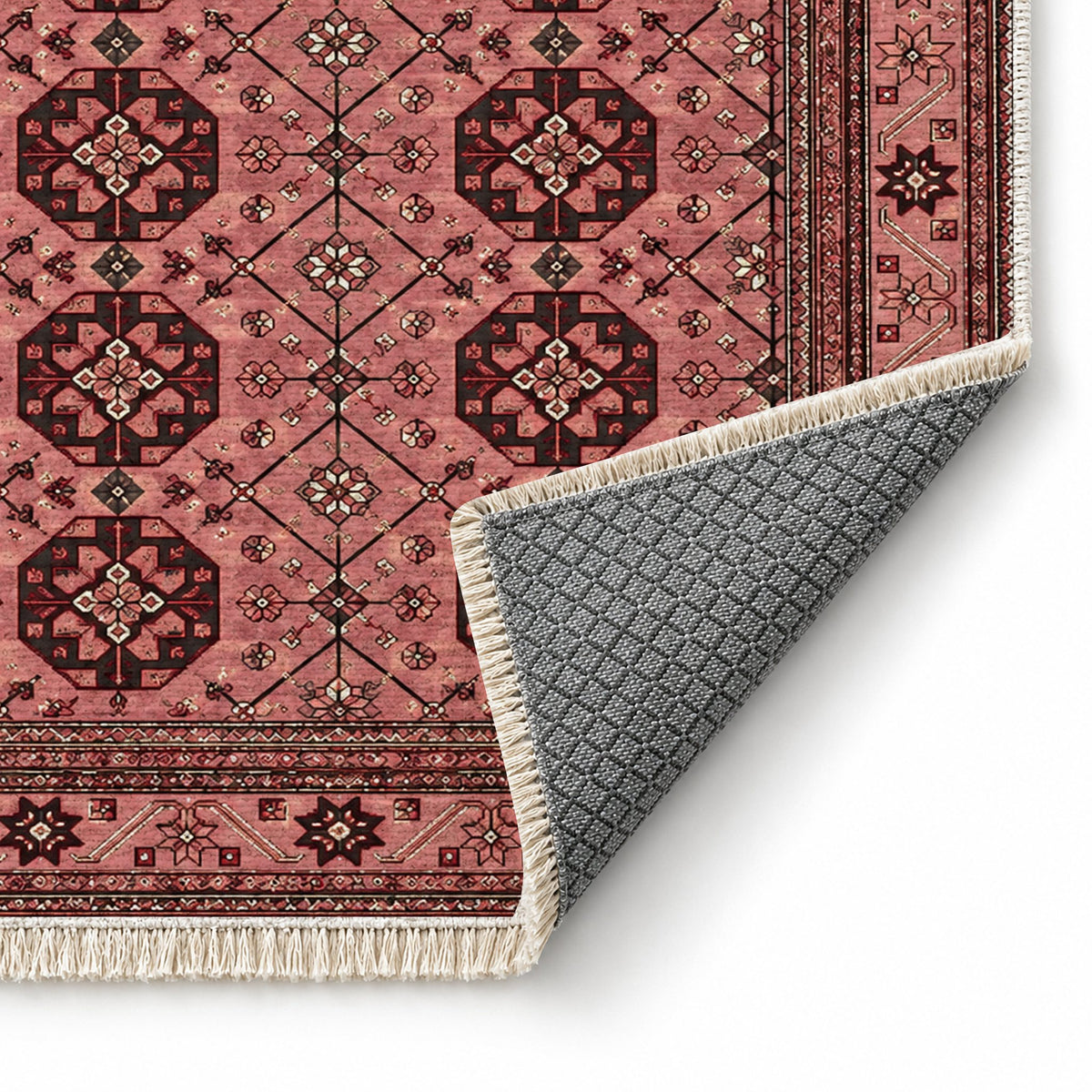 Ersari Lattice Faded Pink washable rug folded corner showing the backing