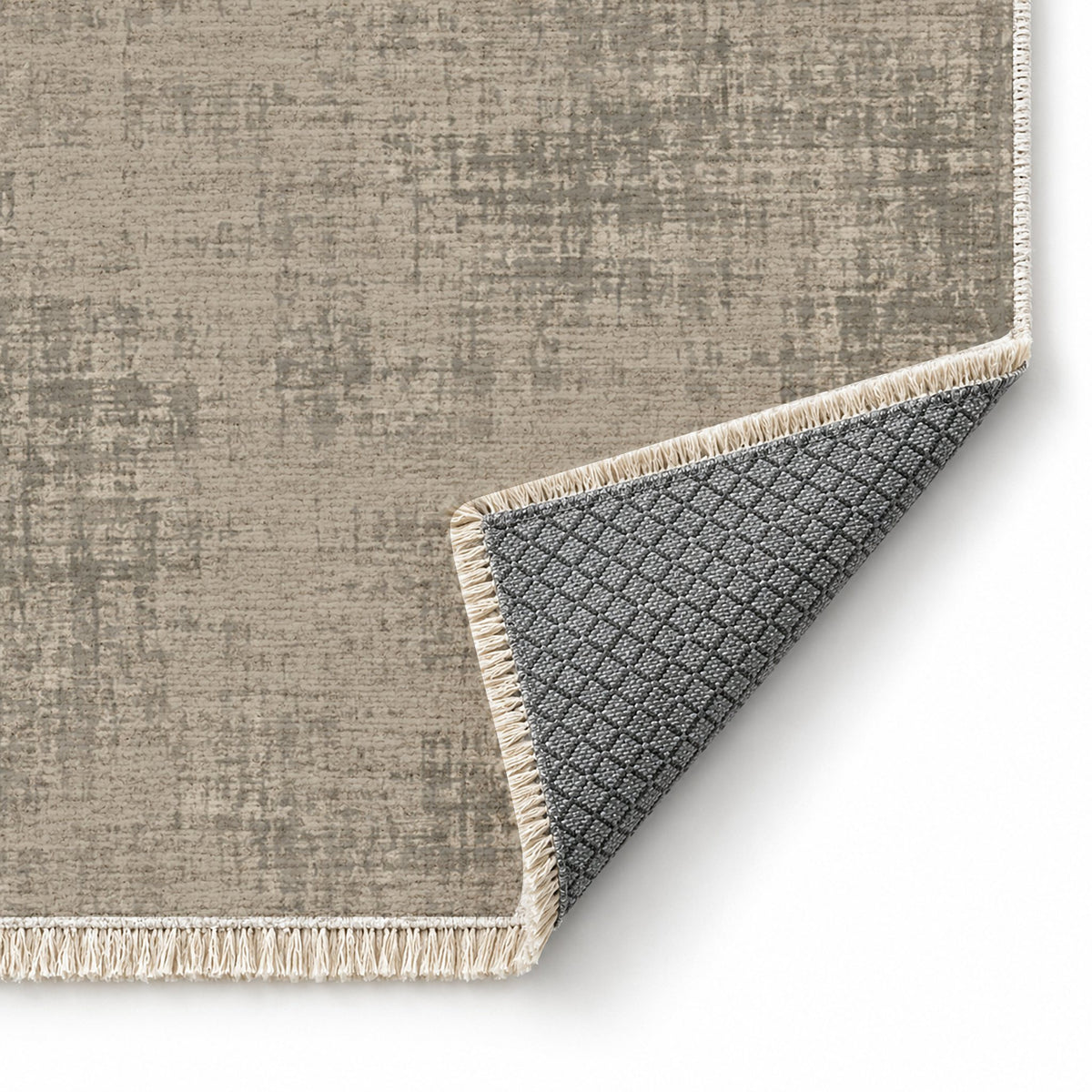 Faded Burlap Greige & Stone washable rug folded corner showing the backing