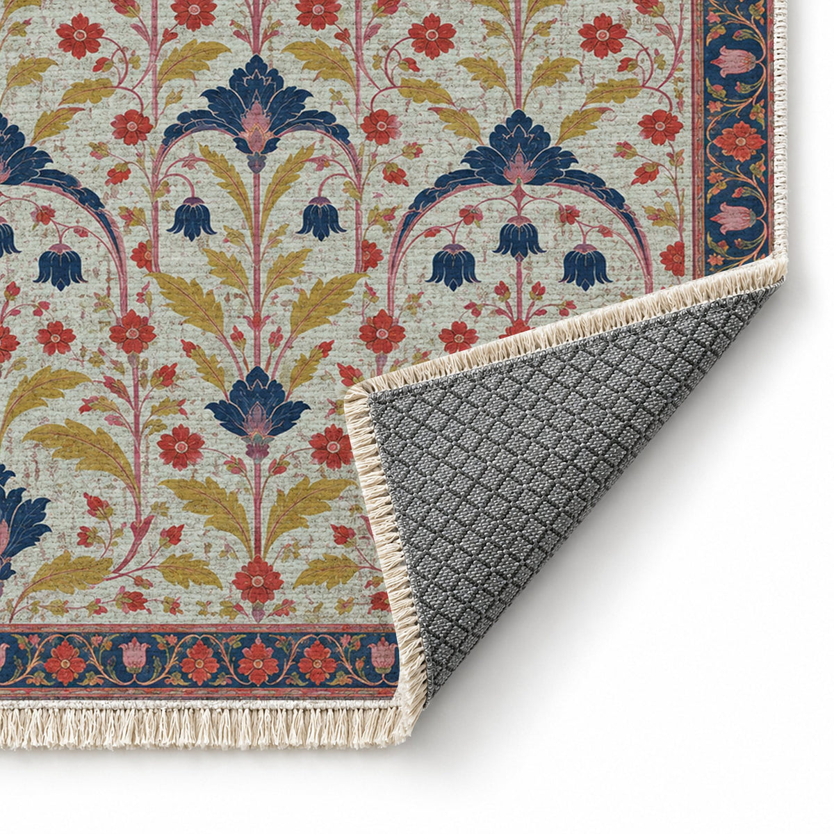 Faded Floral Arcades Glacier, Ink & Vermilion washable rug folded corner showing the backing