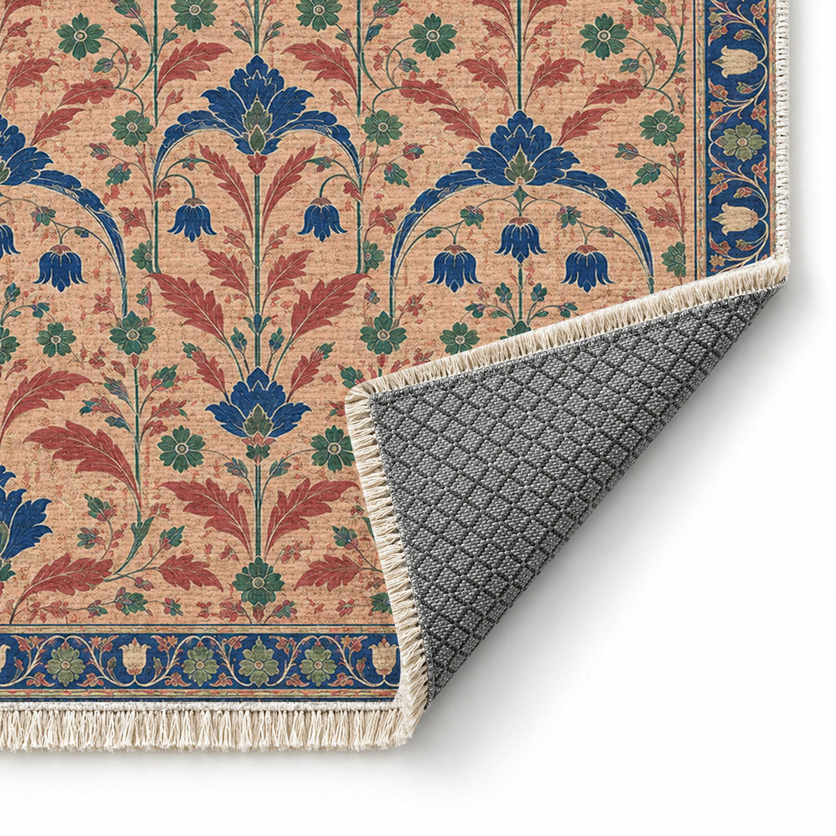 Faded Floral Arcades Peach, Cobalt & Jade washable rug folded corner showing the backing