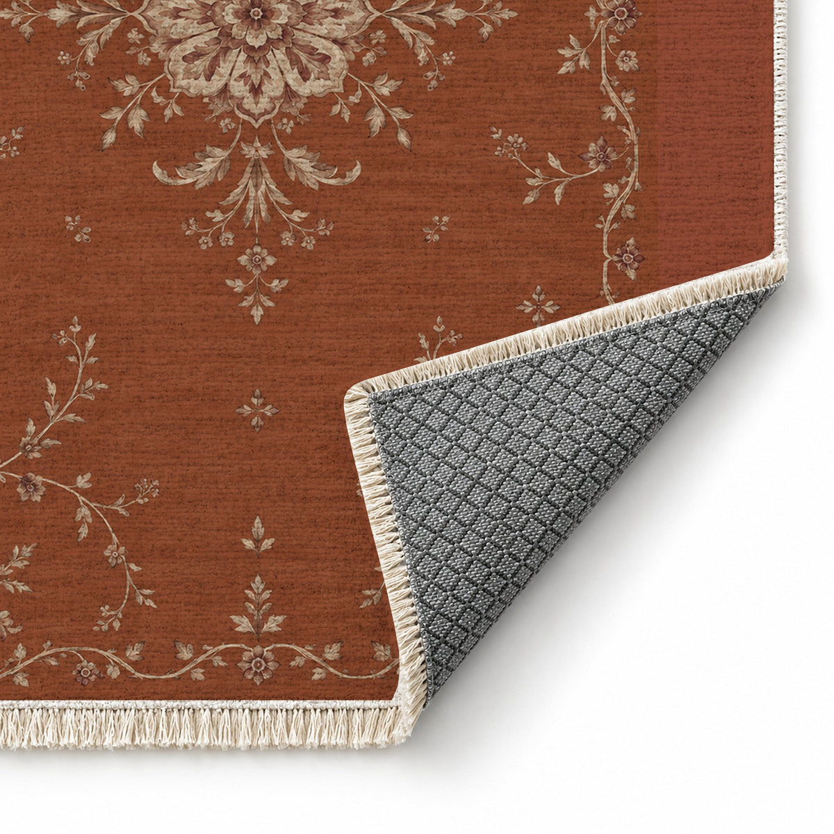 Faded Rosette Rust & Sand washable rug folded corner showing the backing