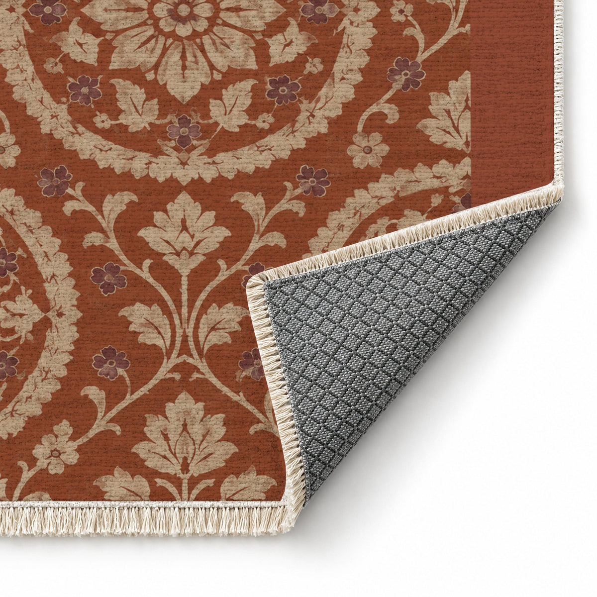 Faded Suzani Rust & Sand washable rug folded corner showing the backing