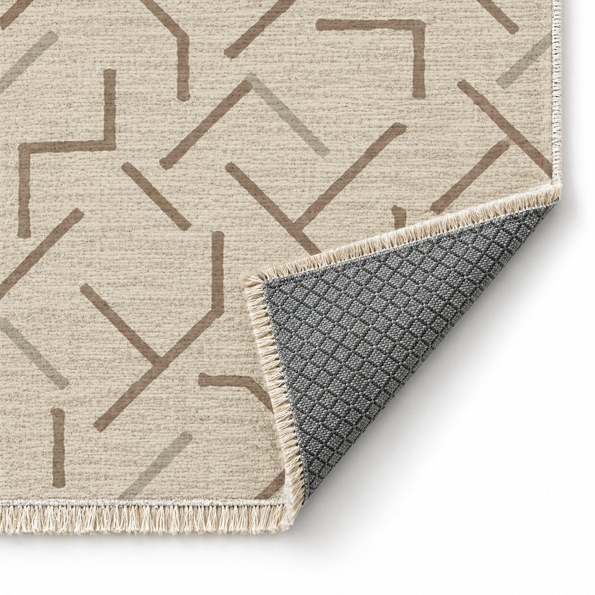 Fragment Geometry Ivory & Taupe washable rug folded corner showing the backing