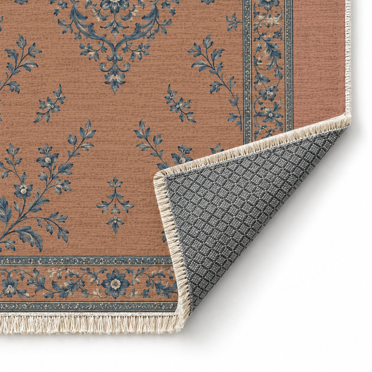 Garden Medallion Clay & Denim washable rug folded corner showing the backing