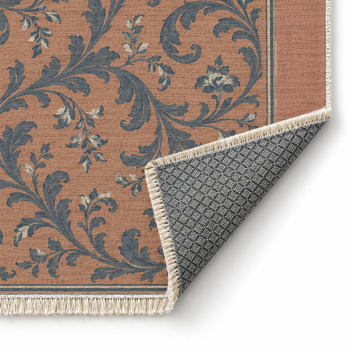 Garden Scroll Clay & Denim washable rug folded corner showing the backing