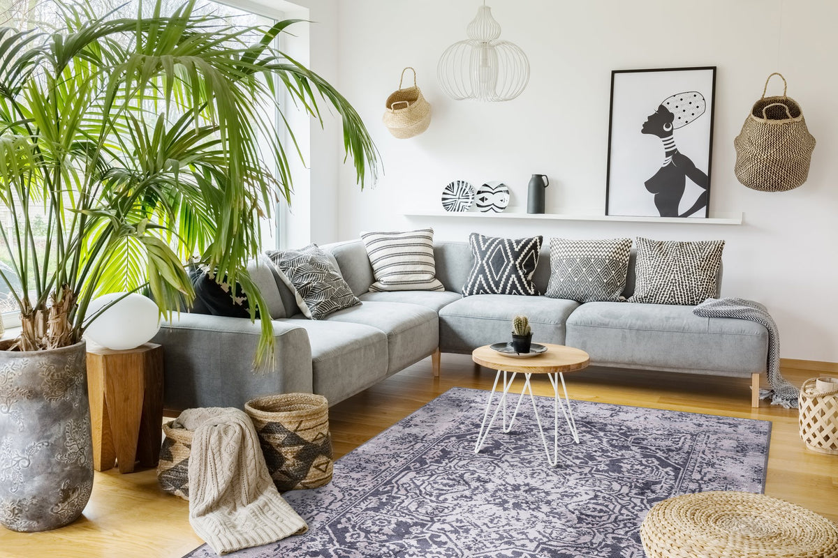 Grey & Charcoal Distressed Medallion Washable Rug in a living room