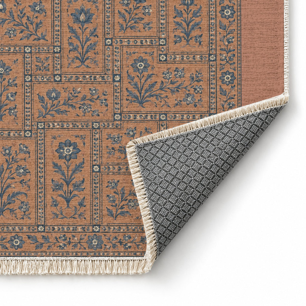 Heritage Tiles Clay & Denim washable rug folded corner showing the backing