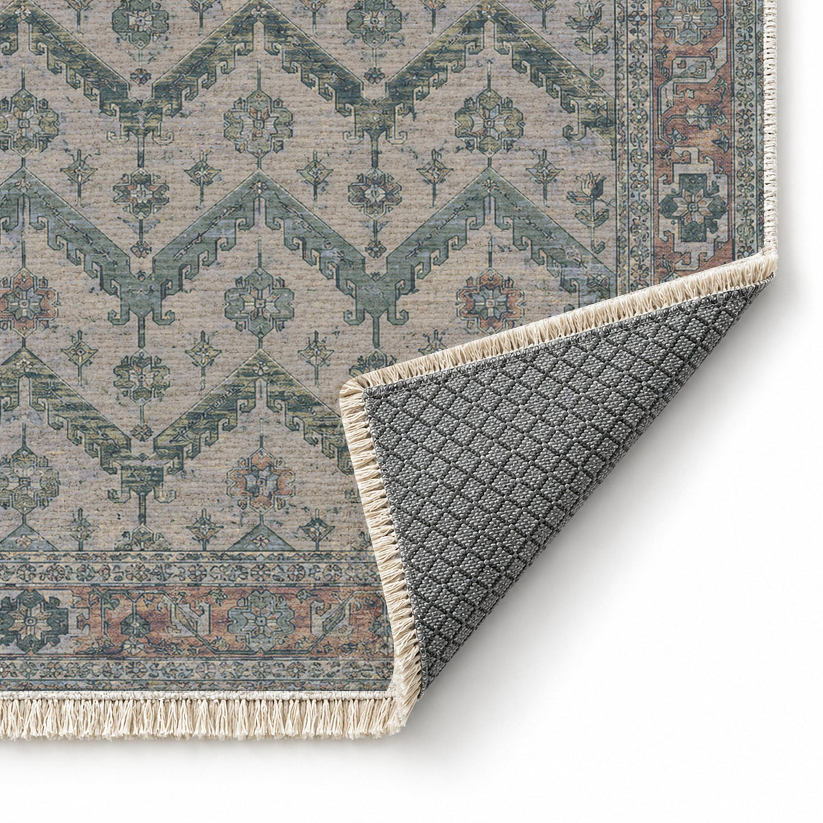 Hooked Chevron Mineral Blue washable rug folded corner showing the backing