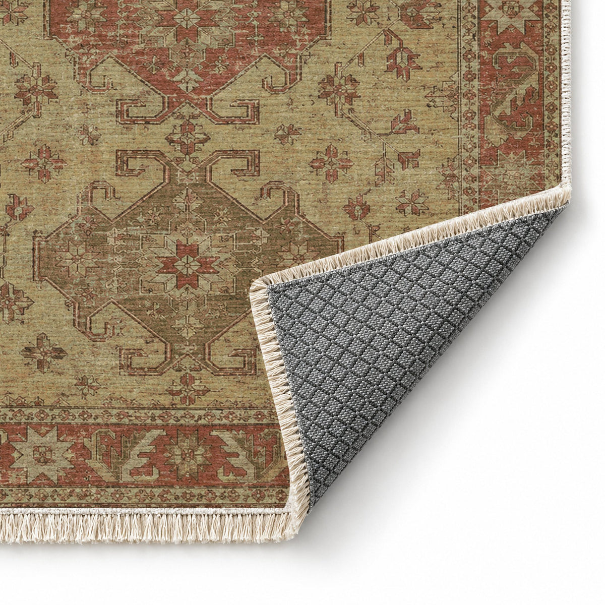 Hooked Shield Clay & Sage washable rug folded corner showing the backing