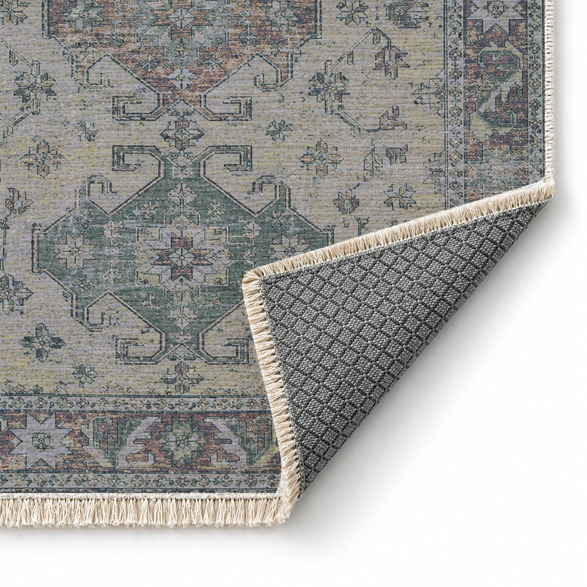 Hooked Shield Mineral Blue washable rug folded corner showing the backing