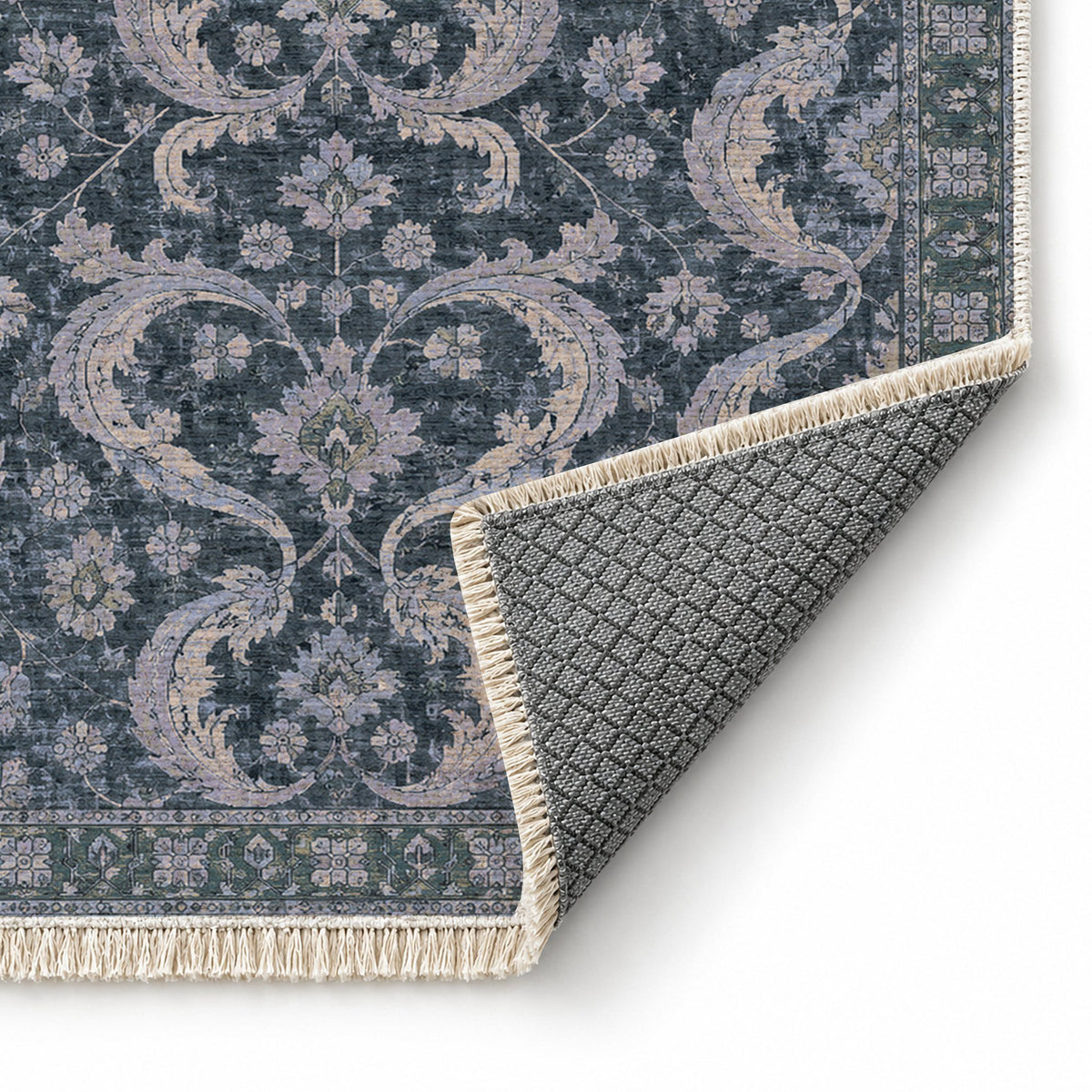 Horn Scroll Mineral Blue washable rug folded corner showing the backing