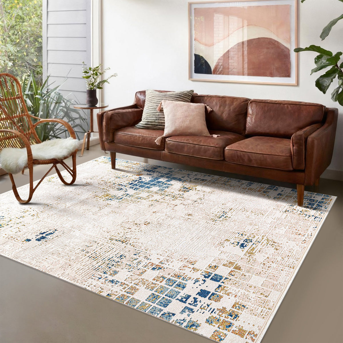 Ivory & Blue Distressed Abstract Area Rug in a living room