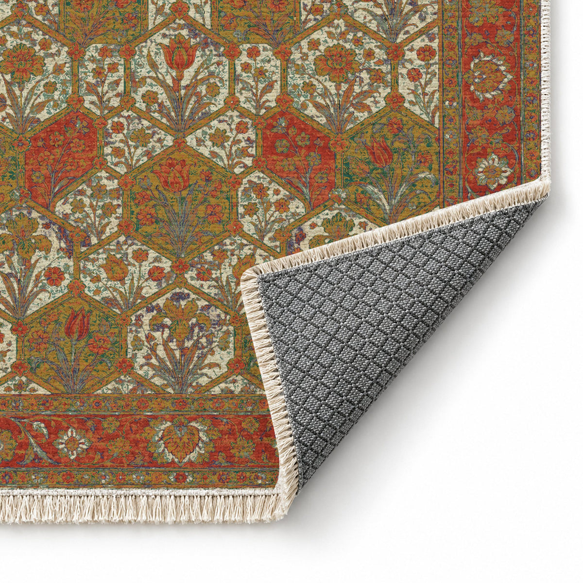 Jali Garden Emerald & Terracotta washable rug folded corner showing the backing