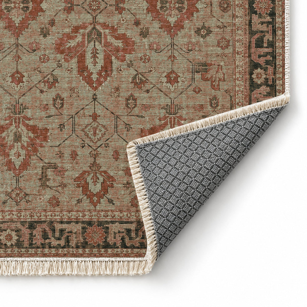 Konya Palmette Clay & Sage washable rug folded corner showing the backing