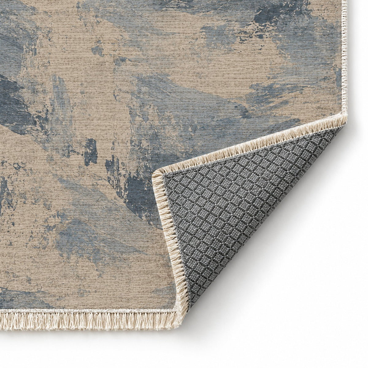 Limewash Field Oat & Dusty Blue washable rug folded corner showing the backing