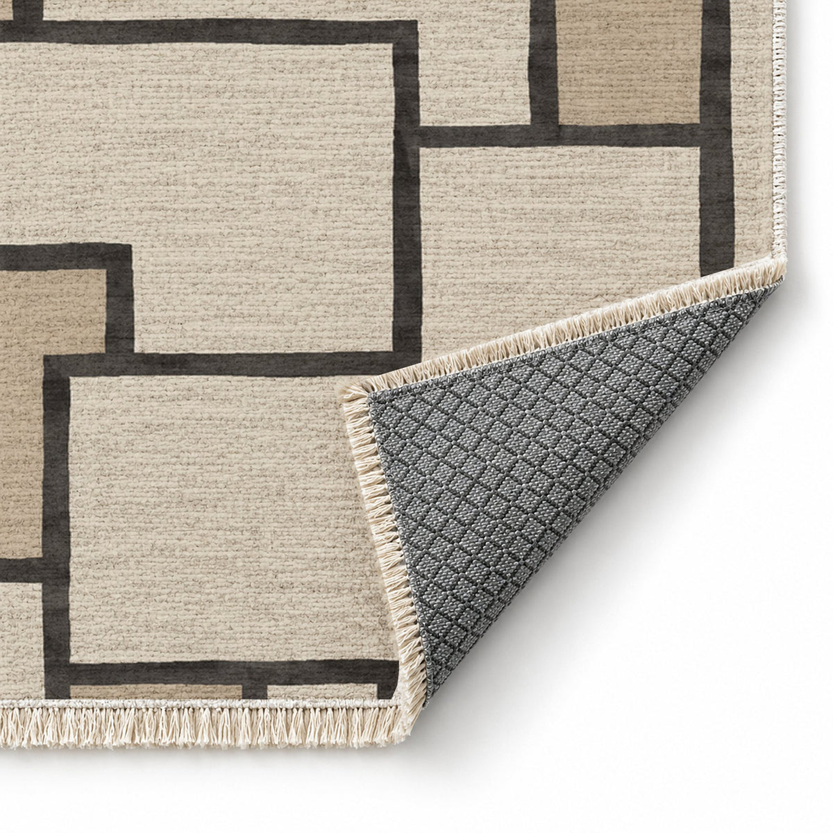 Offset Grid Ivory & Charcoal washable rug folded corner showing the backing