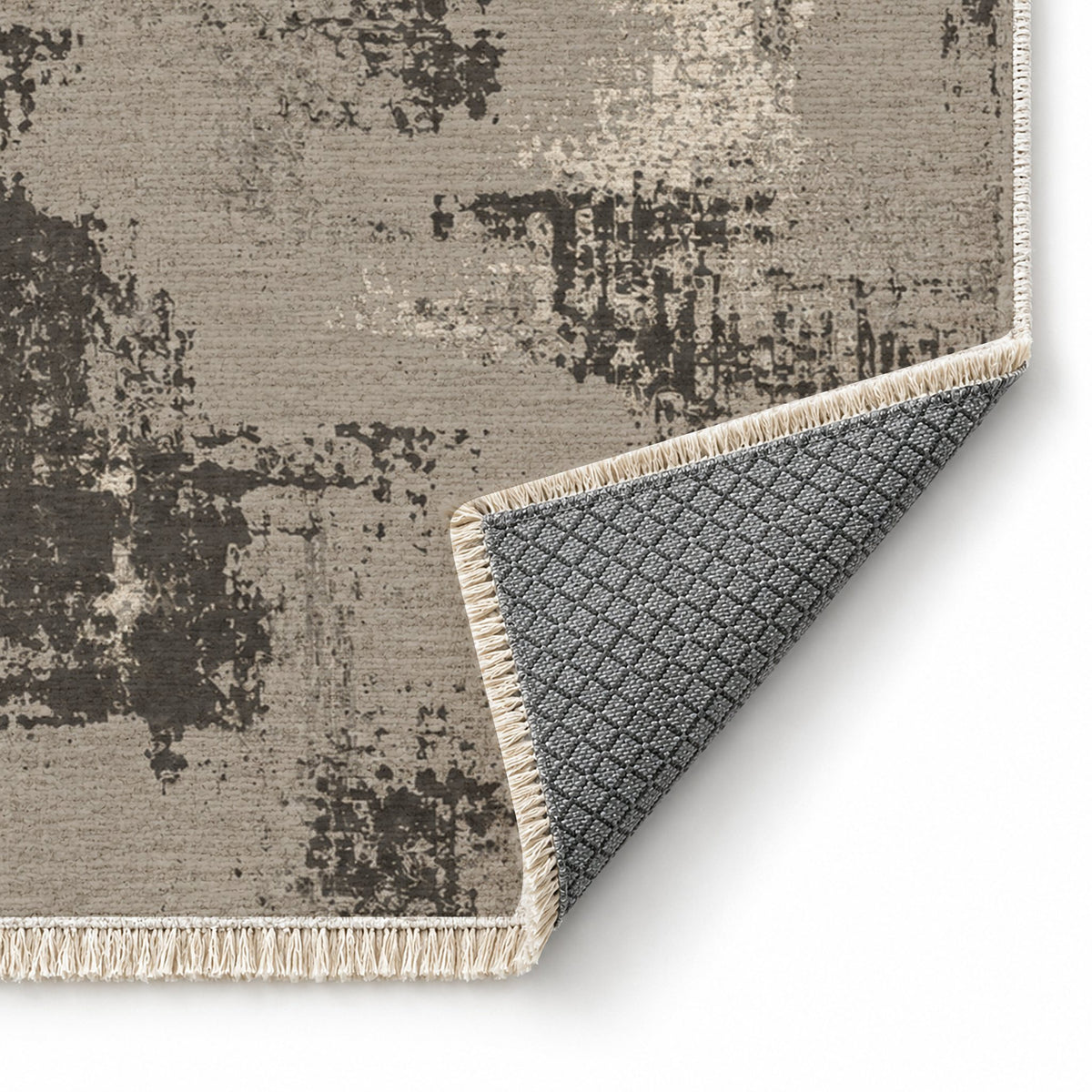 Patina Field Greige & Charcoal washable rug folded corner showing the backing