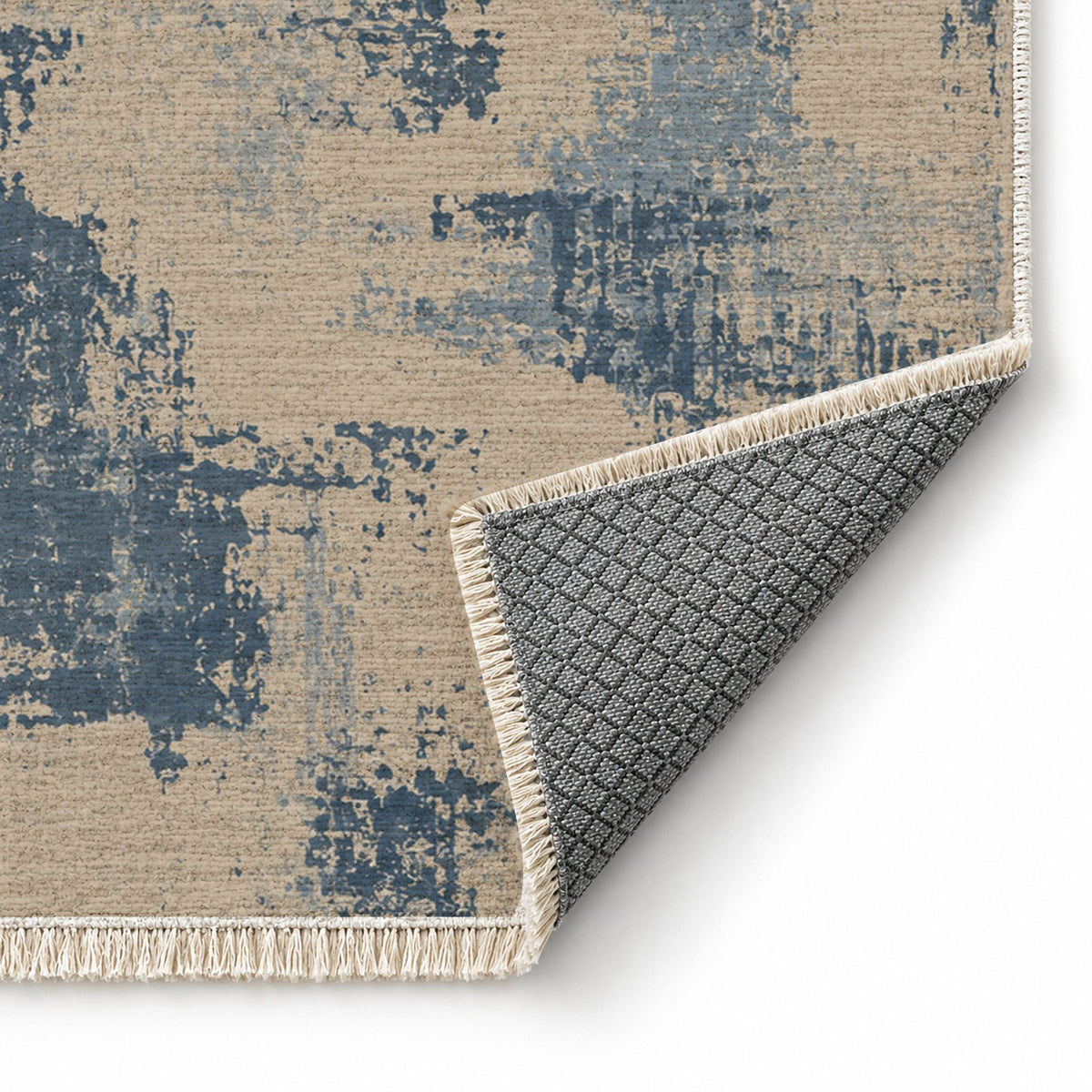 Patina Field Oat & Dusty Blue washable rug folded corner showing the backing