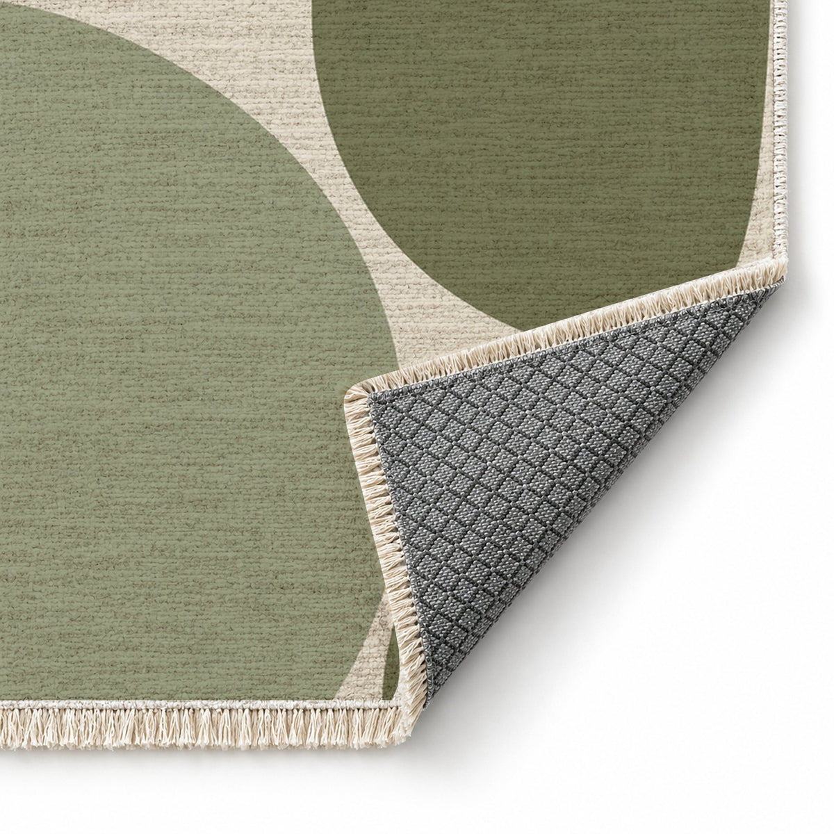 Pebble Forms Ivory & Sage washable rug folded corner showing the backing