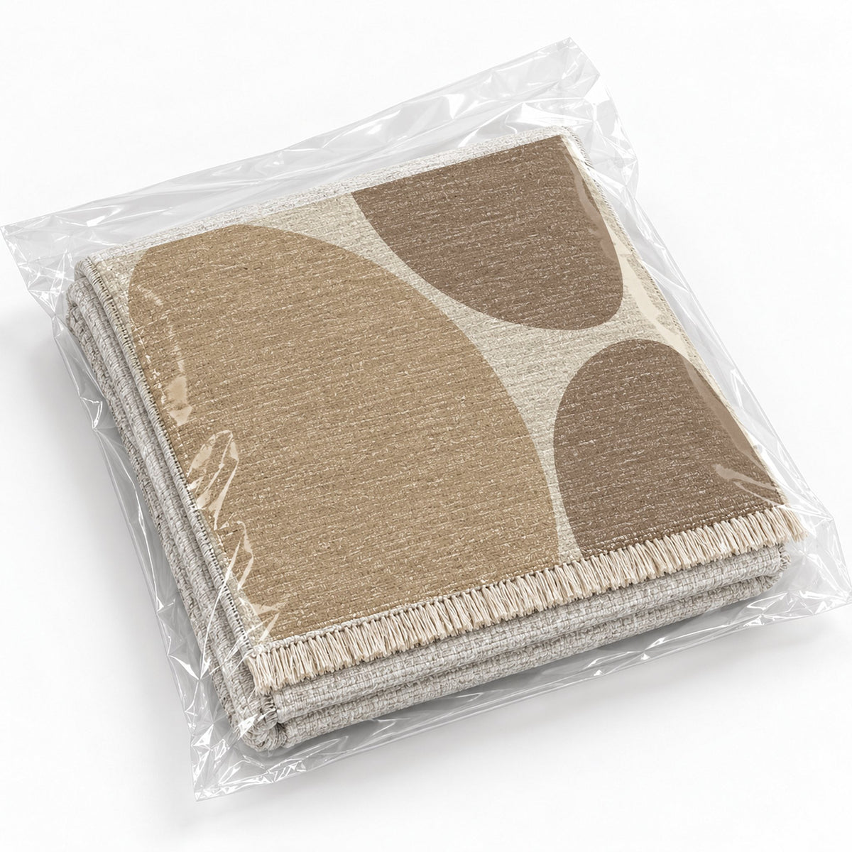 Pebble Forms Ivory & Sand washable rug rolled and packaged