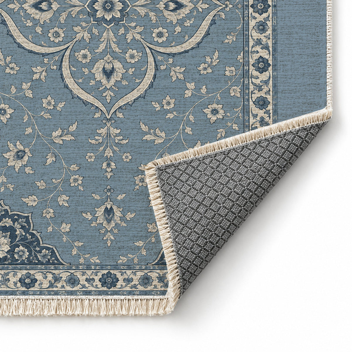 Petal Court Dusty Blue & Ivory washable rug folded corner showing the backing