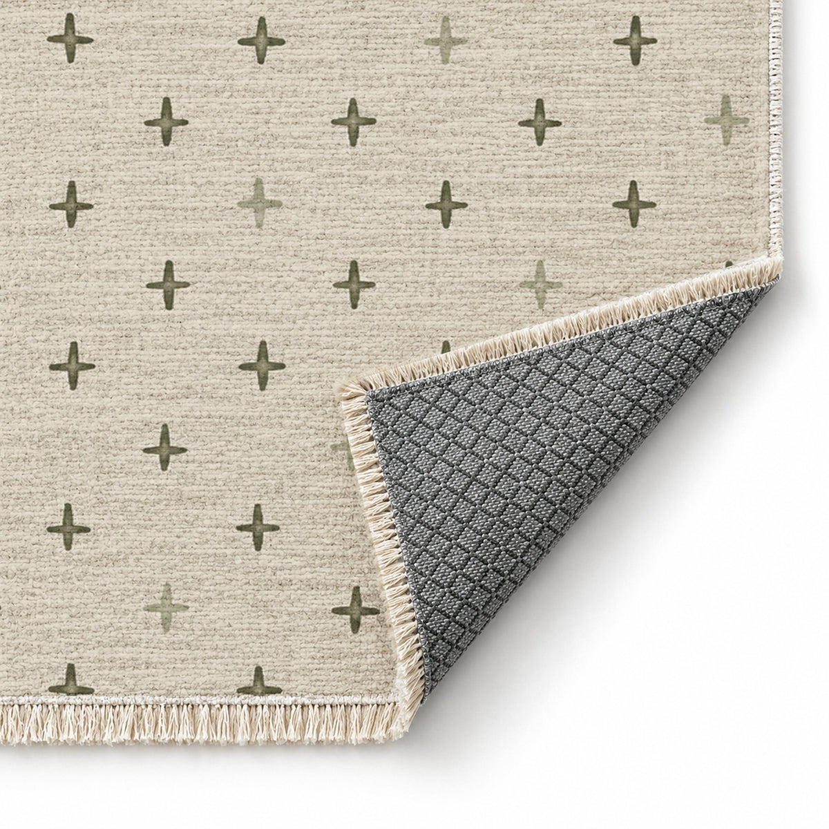 Quiet Crosses Ivory & Olive washable rug folded corner showing the backing