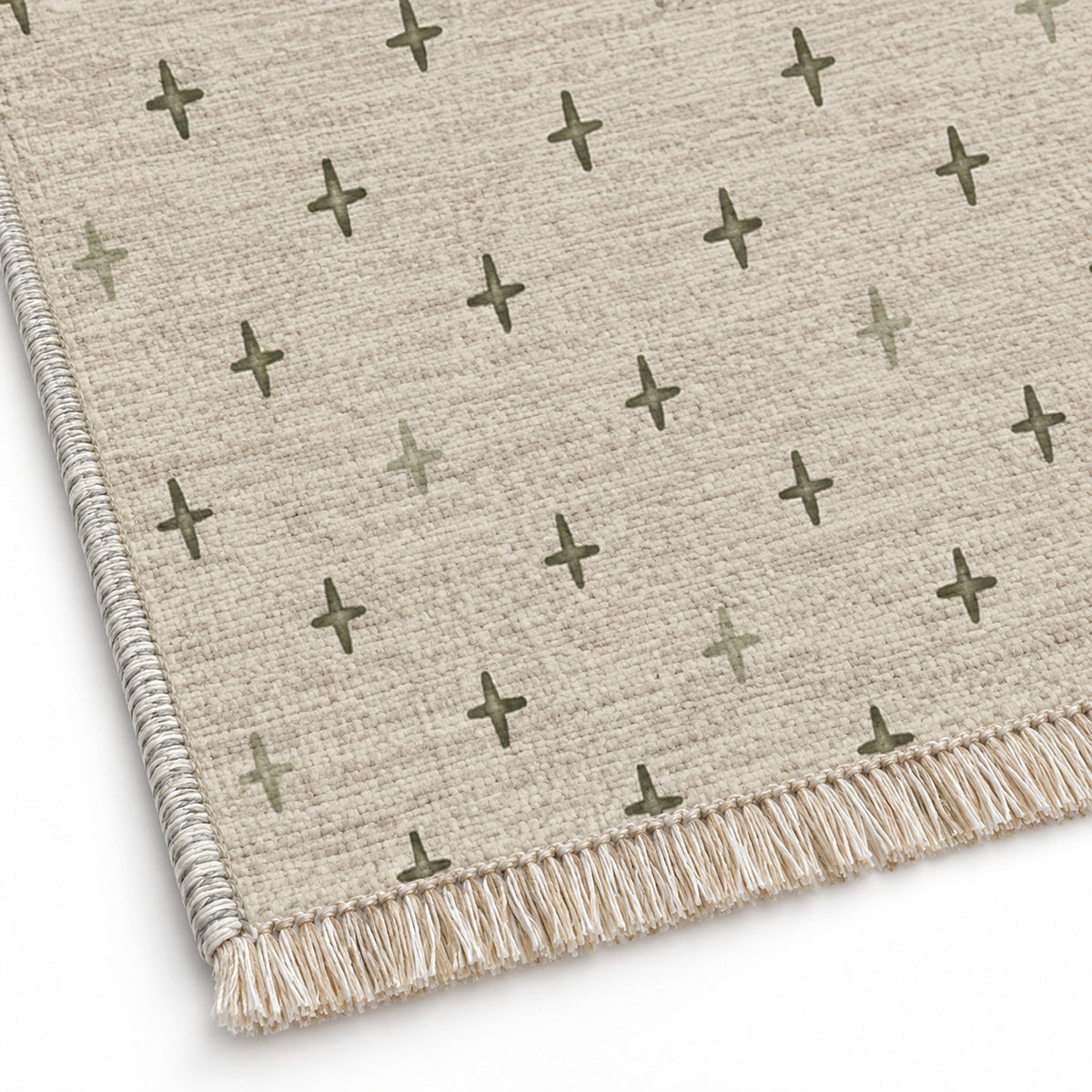 Quiet Crosses Ivory & Olive washable rug close-up of the printed chenille