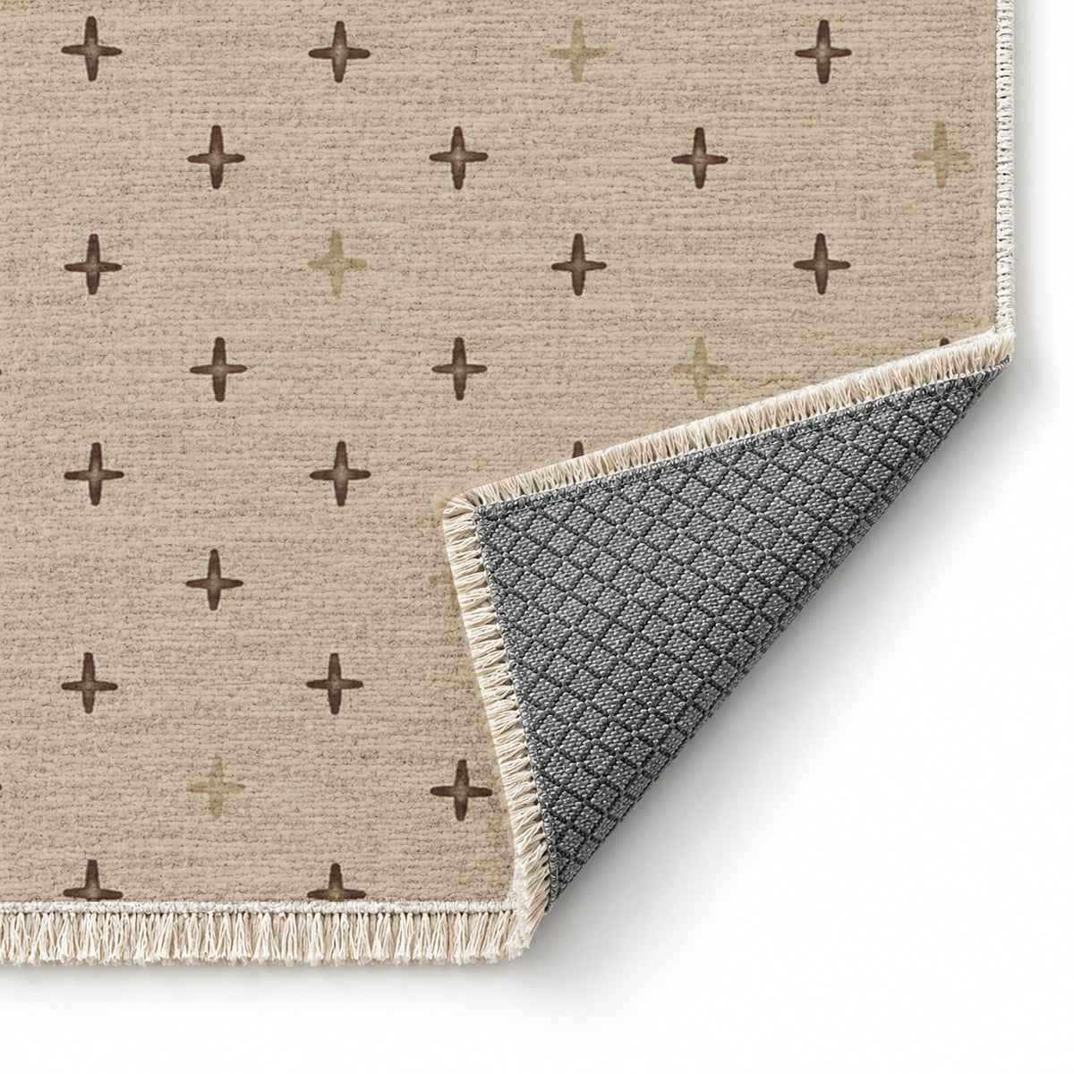 Quiet Crosses Oat & Cocoa washable rug folded corner showing the backing